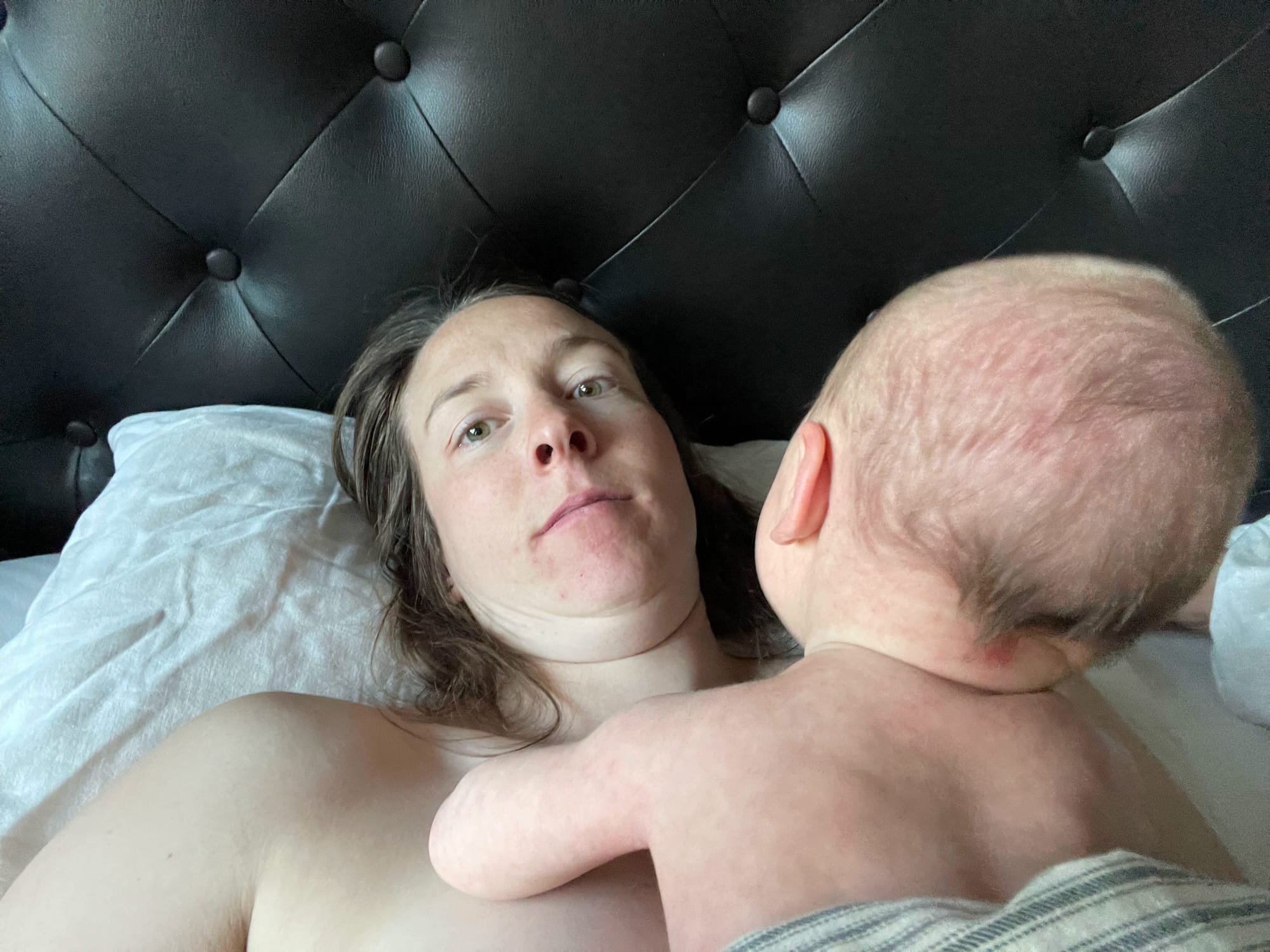 Six-week-old baby looking up at a parent's face